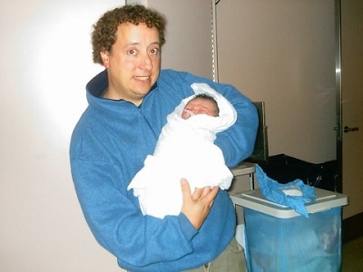 Mark holding baby boy Elijah