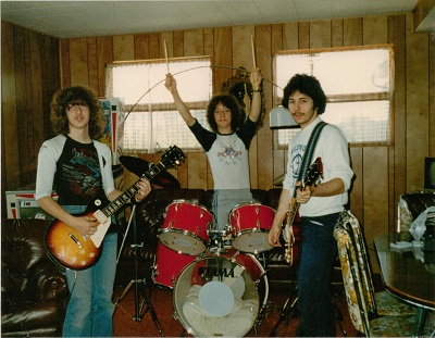 Playing my new drums with my brother and his friend on guitar